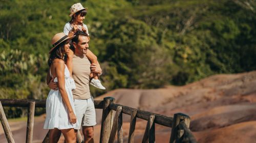 Family visiting Chamarel Seven Coloured Earth Geopark, during school holidays